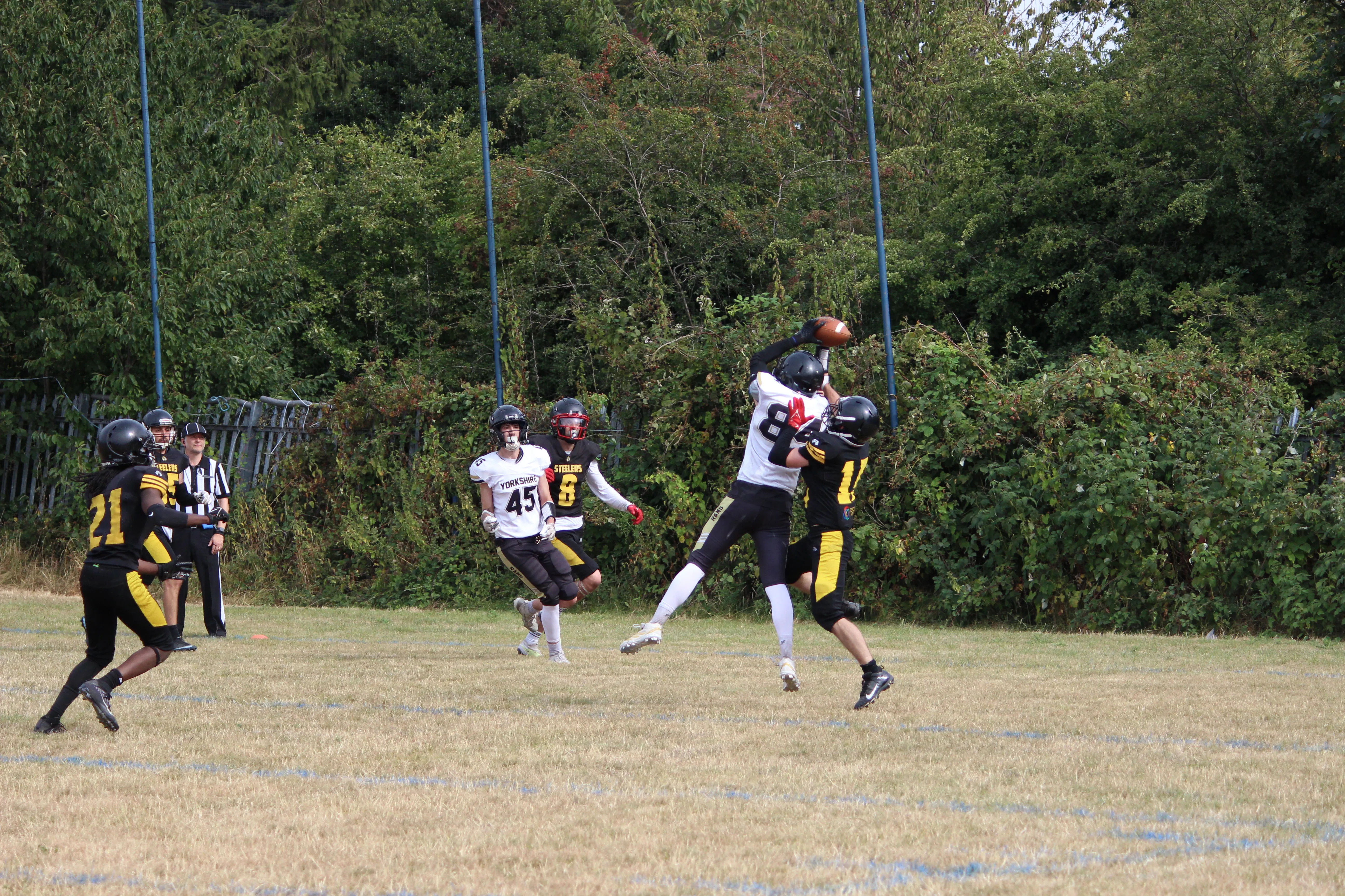 Iago Castro-Charlon rises to haul in a catch against the Steelers