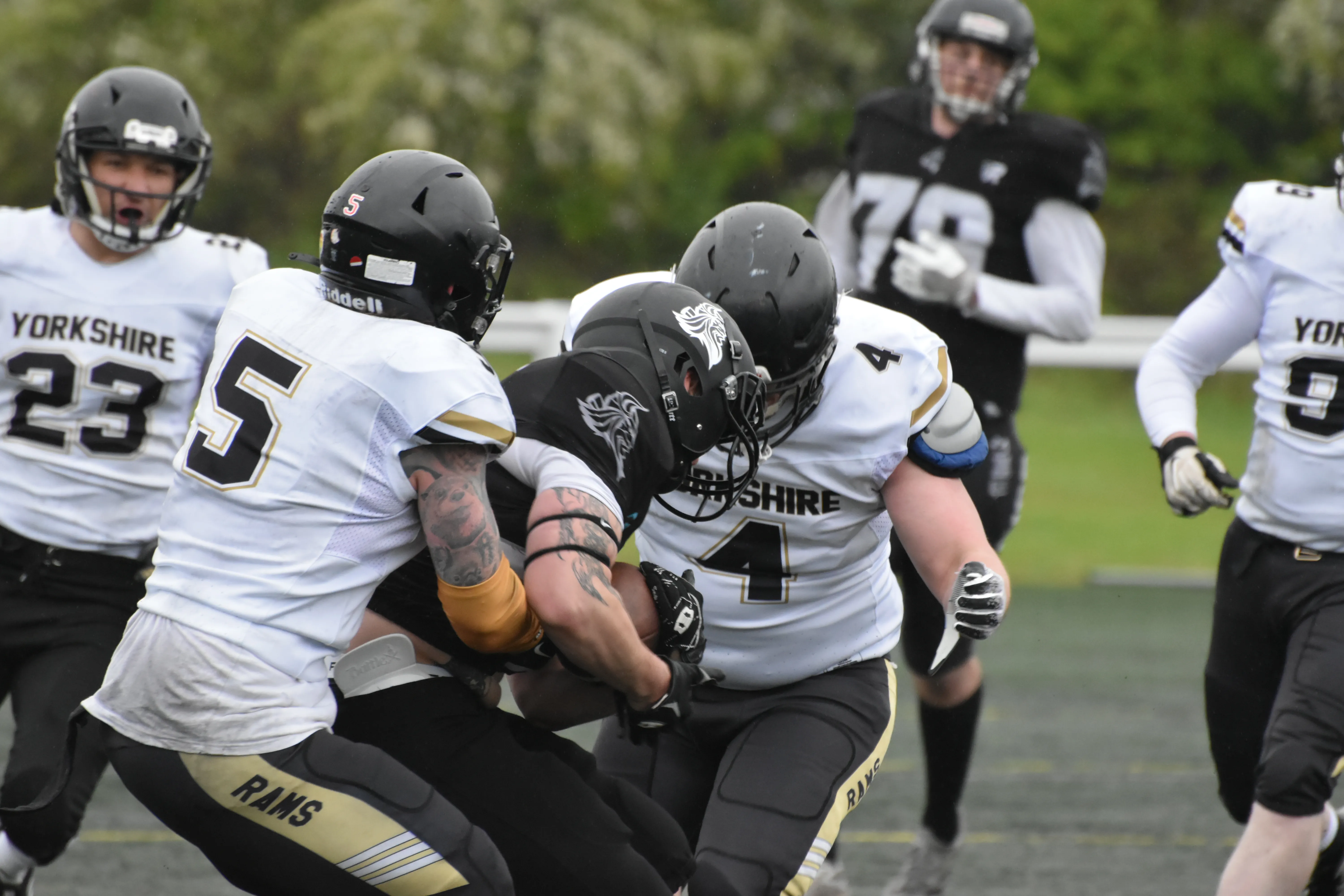 The Rams defence makes a tackle at Druid Park